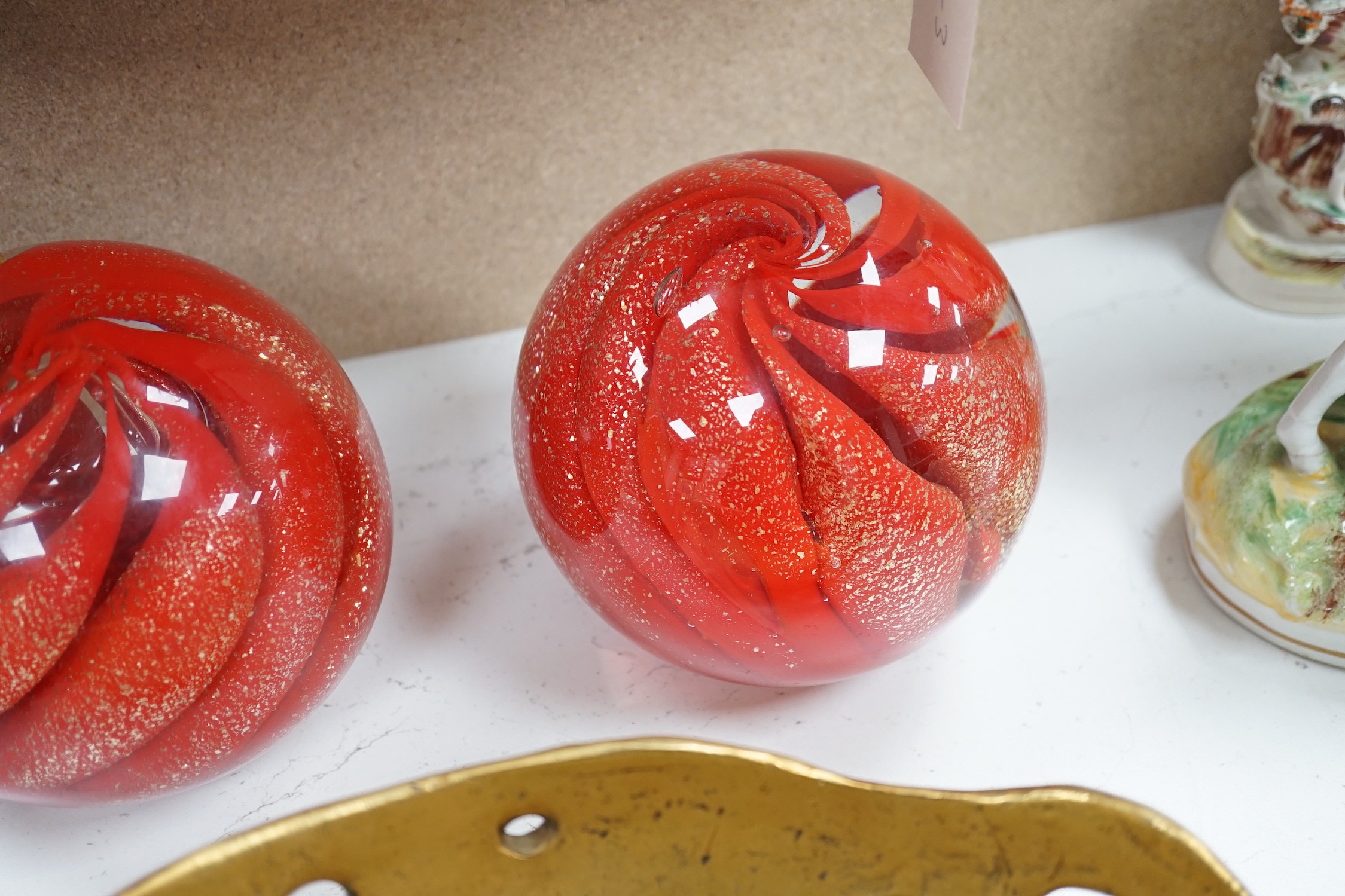 A pair of globular coloured glass ornaments and an art-bronze bowl, 33cm diameter